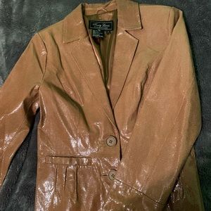Brown leather jacket from Terry Lewis